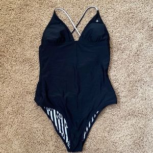 Volcom reversible, one piece swimsuit with tie back.